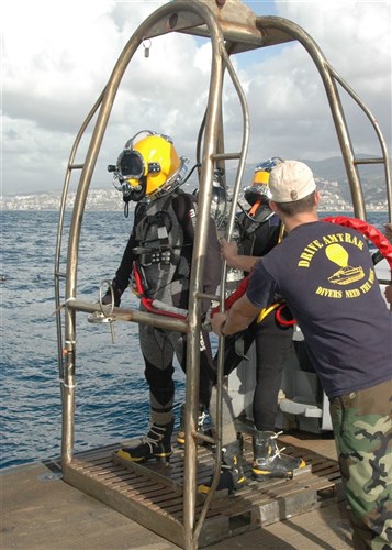 USNS GRAPPLE, At Sea &mdash; Navy Diver 2nd Class Todd Walsh and Navy Diver 2nd Class Matthew Trautman await submersion into the Mediterranean Sea off the coast of Lebanon.
Both divers are attached to Mobile Diving Salvage Unit 2, currently embarked aboard the rescue and salvage ship USNS Grapple (T-ARS 53) for a scheduled deployment.  Grapple is on scene assisting the Lebanese Armed Forces-led recovery operations following the crash of Ethiopian Airlines flight 409 on January 25. (U.S. Navy photo by Mass Communication Specialist 2nd Class William Pittman)