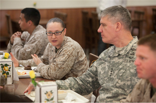 Corporal Deanna Goddard, Special-Purpose Marine Air-Ground Task Force Africa travel clerk from Tracy, Calif., talks with U.S. Africa Command Commander Gen. David Rodriguez over lunch during the general’s command visit to Naval Air Station Sigonella, Italy, June 11, 2013. 