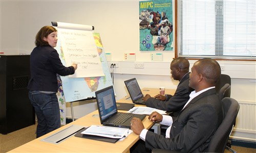 Captain John Bernard Kivunge (right) and Captain YL Kebero from the Tanzanian Peopleeâs Defense Forces (TPDF) with Nikki Decie,  an instructor at the Regional Joint Intelligence Training Facility (RJITF)during the Instructor Development Course (IDC) taught at the at RAF Molesworth this week.  (Photo by Melony Angelilli)