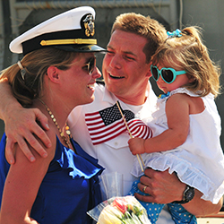 Service member reuniting with his family