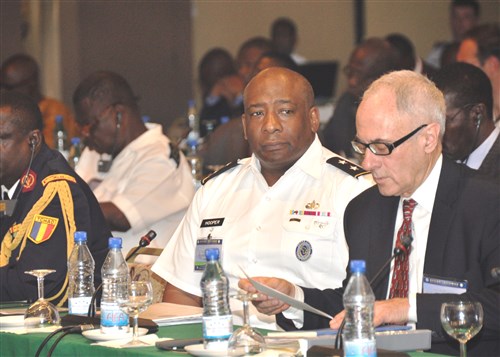 COTONOU, Benin - Ambassador William Bellamy, director of Africa Center for Strategic Studies, and Major General Charles Hooper, U.S. Africa Command, listen as (not pictured) Rear Admiral E.O. Ogbor, chief of Training and Operations, Nigerian Naval Headquarters, reads a Memorandum of Understanding during the Economic Community of Central African States (ECCAS) and Economic Community of West African States (ECOWAS) Maritime Safety and Security Conference held in Cotonou, Benin, March 26-29, 2012.  More than 250 representatives from more than 20 African nations attended the conference, which was held to facilitate cooperation between both African communities in order to provide regional maritime security in the Gulf of Guinea. The event was organized and facilitated by U.S. Africa Command and Africa Center for Strategic Studies. (U.S. AFRICOM photo by Staff Sergeant Olufemi A. Owolabi)