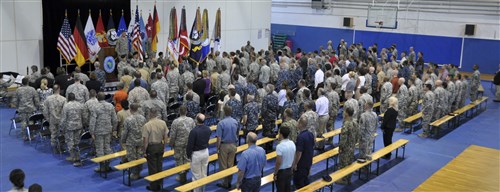 U.S. Africa Command personnel and staff gather to observe the Command Senior Enlisted Leader Change of Responsibility Ceremony from Command Chief Master Sergeant Jack Johnson Jr. to Command Sergeant Major Darrin J. Bohn at the U.S. Army Garrison Stuttgart Kelley Barracks Gym, 12 July. General David M. Rodriguez, Commander, U.S. Africa Command, presided over the ceremony. (U.S. Navy photo by Mass Communication Specialist First Class D. Keith Simmons/Released)