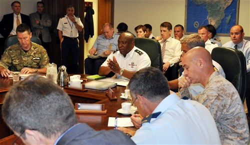 Major General Charles Hooper, director of Strategy, Plans and Programs
Directorate (J5) at U.S. Africa Command, addresses delegates from United Kingdom,
Canada, Italy, NATO and the United Nations during a meeting held at the command’s headquarters July 29, 2013, to discuss how U.S. and its international partners could cooperate to improve security and stability in Libya.  (Photo by Technical Sergeant Olufemi A. Owolabi)      
