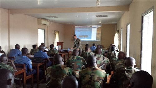 Sergeant Kevin Vicario gives a class to service members with the Ghanaian Armed Forces on motor transportation maintenance during a theater security cooperation engagement in Ghana, Dec. 1, 2014. Vicario, a Tampa, Fla., native is part of a Mobile Training Team with SPMAGTF Crisis Response-Africa and is working alongside the Ghanaian Armed Forces to help enhance motor transportation maintenance and basic daily operations to include safety, records management, parts procurement, and parts accountability. (Courtesy photo)