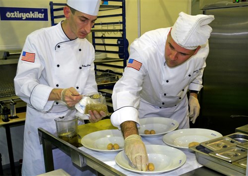 ISTANBUL, Turkey - Petty Officer 2nd Class Matthew Bauman and Chief Petty Officer Brandon Parry prepare their first course of triage shellfish bisque during the   Ã¢ÂCook and ServeeeÃ¢Â category of the 9th International Istanbul Gastronomy Festival February 20, 2011, in Istanbul, Turkey. Four Culinary Specialists from U.S. Naval Forces Europe-Africa, the maritime component of U.S. Africa Command (AFRICOM), competed against more than 1,200 culinary artists from around the world at the festival, hosted by the All Cooks Federation of Turkey, during which they received a silver medal, a bronze medal and the top sanitation and hygiene award for their efforts. (U.S. Navy photo by Petty Officer 1st Class Elizabeth Malek)