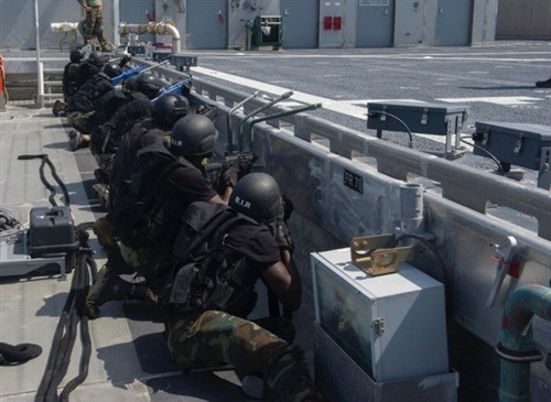 GULF OF GUINEA (April 21, 2014) – Personnel assigned to U.S. Naval Special Warfare Group (NSWG) 10, Nigerian Special Boat Services (NSBS), Cameroonian Rapid Intervention Battalion (BIR) and Netherlands Maritime Special Operations Forces (NMSOF) secure the flight deck during a simulated boarding of the joint high-speed vessel USNS Spearhead (JHSV 1) as part of Obangame Express 2014. Obangame Express is a U.S. Africa Command sponsored multinational maritime exercise designed to increase maritime safety and security in the Gulf of Guinea. (U.S. Navy photo by Mass Communication Specialist Seaman Justin R. DiNiro/ Released)