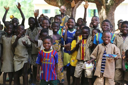 Students in the village of Atome, Togo look forward to receiving their new school as a gift from the people of the U.S. in late 2014. Representatives from the U.S. Embassy in Lome, contractor, CNaF-SET and the U.S. Army Corps of Engineers Europe District visited the school project site to check on contruction progress April 30, 2014. The project is being executed through the Department of Defense's AFRICOM humanitarian assistance program to improve future prospects for Togolese youth. (U.S. Army Corps of Engineers photo by Jennifer Aldridge)