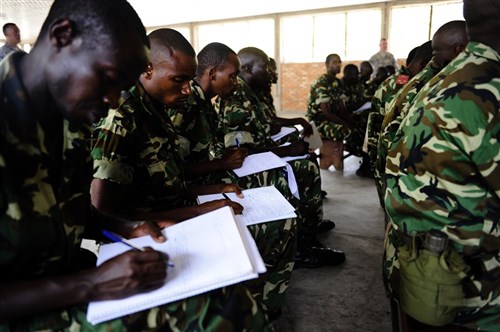 Burundi National Defense Force soldiers take notes during a class discussion about gender issues at Gukumba Training Area in Bujumbura, Burundi, Sept. 16, 2014. The soldiers participated in the two-week civil military cooperation engagement, led by Team 3, Charlie  Company, 407th Civil Affairs Battalion, forward deployed from Combined Joint Task Force-Horn of Africa, Camp Lemonnier, Djibouti, intended to enhance the understanding of counter insurgency and civil military operations in preparation for their support of the African Union Mission in Somalia (AMISOM). (U.S. Air Force Photo by Staff Sgt. Jocelyn A. Ford)