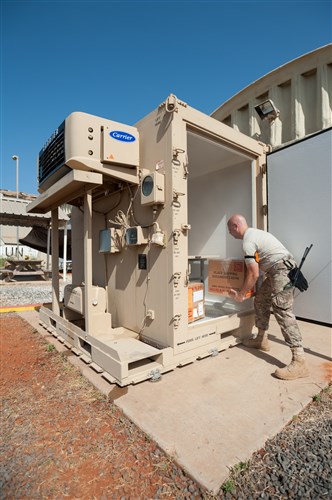 U.S. Air Force Tech. Sgt. Jarrod Blanford, an aerial porter from the Kentucky Air National Guard’s 123rd Contingency Response Group, removes whole blood from a refrigerated storage unit outside the Joint Operations Center for Joint Task Force-Port Opening Senegal at Léopold Sédar Senghor International Airport in Dakar, Senegal, Oct. 22, 2014. The blood is being sent to Liberia to support U.S. troops deployed for Operation United Assistance, the U.S. Agency for International Development-led, whole-of-government effort to respond to the Ebola outbreak in West Africa. (U.S. Air National Guard photo by Maj. Dale Greer)