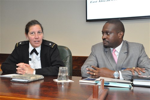 AFRICOM’s Director for Intelligence and Knowledge Management, U.S. Army Brig. Gen. Jody Daniels, left, responds to a comment from Col. Mgisa Masha, Tanzania’s Defence Liaison Officer to the East African Community (EAC), who visited AFRICOM as part of the EAC delegation, Nov. 6, Kelley Barracks, U.S. Army Garrison in Stuttgart, Germany.  The EAC is the regional intergovernmental organization of the Republics of Burundi, Kenya, Rwanda, and Uganda and the United Republic of Tanzania, with its headquarters in Arusha, Tanzania.  Amb. Phillip Carter, AFRICOM Deputy to the Commander for Civil-Military Engagements, welcomed the delegation, saying, “Your presence here will help re-energize the rapport between the U.S. and the EAC by establishing relationships that will play a key role as we partner with you in the region.” (U.S. Africa Command photo by Brenda Law/Released)