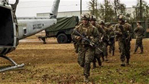 Marines with 2nd Battalion, 8th Marine Regiment practice entering and exiting the MV-22B Osprey during a simulated Tactical Recovery of Aircraft and Personnel, or TRAP, mission aboard Marine Corps Air Station New River, Dec. 9, 2014. The TRAP training provides designated forces tactical training and initial evaluation in order to conduct search and personnel recovery operations for the upcoming deployment with Special-Purpose Marine Air-Ground Task Force Crisis Response-Africa. (Photo by Lance Cpl. Krista James)