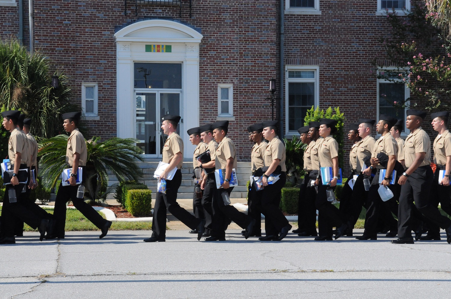 PENSACOLA, Fla. (Aug. 14, 2015) Sailors attending Information Systems Technician A-school at Center for Information Dominance Unit Corry Station march to class. They are preparing to engage in a broad range of responsibilities including network administration, database management, and troubleshooting computer hardware and software. U.S. Navy photo by Carla M. McCarthy 