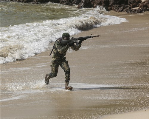 A Compagnie Fusilier de Marin Commando moves up the beach during the final exercise with U.S. service members in Dakar, Senegal, Sept. 17, 2015. The Marines and Coast Guardsmen with Special-Purpose Marine Air-Ground Task Force Crisis Response-Africa spent four weeks training the COFUMACO on basic infantry tactics and small-boat operations as a part of a Maritime Security Force Assistance mission to increase interoperability with Senegal’s and strengthen the bond between the partner nations. (U.S. Marine Corps photo by Cpl. Olivia McDonald/Released)