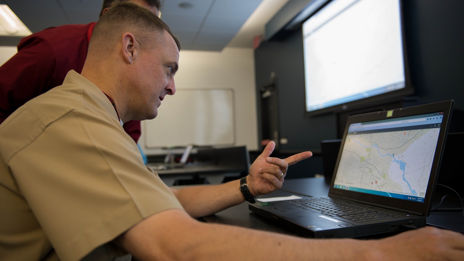 Brig. Gen Michael Groen, the director of Marine Corps Intelligence, tests the capabilities and functions of the new Tellus program to judge its effectiveness, May 29, 2015. Tellus can be used to instantly report new information to patrols and convoys without the use of radio. 