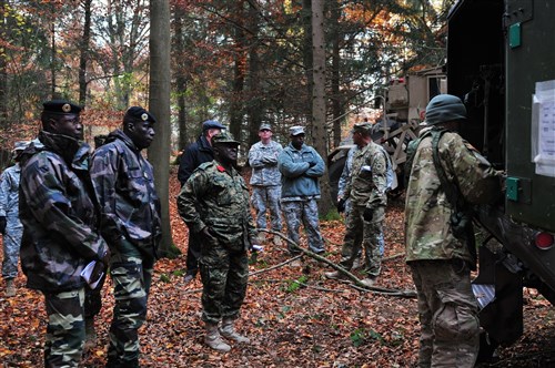 U.S. Army Capt. Brian Bagget of the Joint Multinational Readiness Center (JMRC), Adler Observer Coach Trainer gives a brief and tour to the African Partners’ nations Distinguish Visitors about the 1ABCT/3ID CTC’s rotation (BSA Medical Role 1 & 2) casualty evacuation felicity at JMRC, on Nov. 4, 2015. The purpose of this event is to provide a forum to engage in dialogue on effective methods to train, develop, and enhance rapid deployment of peacekeeping forces, and share lessons learned IOT strengthen existing defense institutions in our African Partners’ nations. (U.S. Army photos by Sgt. Gemma Iglesias)