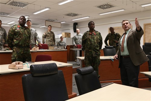 (From Right) Carl Giles, director of Instrumentation Training Analysis Computer Simulations and Support team, speaks with Maj. Gen. Molefi Seikano, Ground Forces Commander, Botswana Defense Force, and his party, to provide an understanding of how ITACSS benefits unit training during a U.S. Army Africa command sponsored visit to the Joint Multinational Readiness Center, Hohenfels, Germany, Dec. 3, 2015. The visit offered Botswana leadership an opportunity to observe JMRC facilities and capabilities, as well as explore opportunities for future training and partnership. (U.S. Army photos by Sgt. Gemma Iglesias)