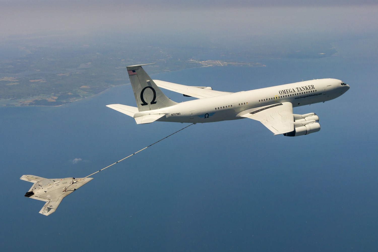 PATUXENT RIVER, Md. (April 22, 2015) The Navy's unmanned X-47B receives fuel from an Omega K-707 tanker while operating in the Atlantic Test Ranges over the Chesapeake Bay. This test marked the first time an unmanned aircraft refueled in flight. U.S. Navy photo. 