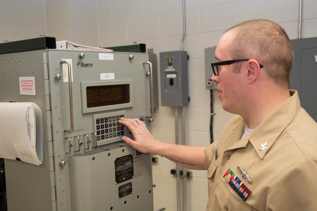 VIRGINIA BEACH, Va. (March 24, 2015) Center for Surface Combat Systems Unit (CSCSU) Dam Neck’s  Electronics Technician 2nd Class Matthew Turner performs maintenance on the AN/WSN 7 Inertial Navigation System.  U.S. Navy photo by Chief Interior Communications Electrician William Massey, CSCSU Dam Neck.