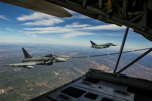 A Eurofighter Typhoon with the Spanish Air Force receives fuel from a U.S. Marine KC-130J Hercules with Special-Purpose Marine Air-Ground Task Force Crisis Response-Africa, August 13, in Spain. A total of five Spanish pilots and their aircraft had the opportunity to practice their air-to-air refueling skills with the Marines from SPMAGTF-CR-AF. While this particular training was a first for the two countries, the U.S. and Spain work together routinely, fostering one of the closest defense partnerships around the world.(U.S. Marine Corps photo by Staff Sgt. Vitaliy Rusavskiy/Released)