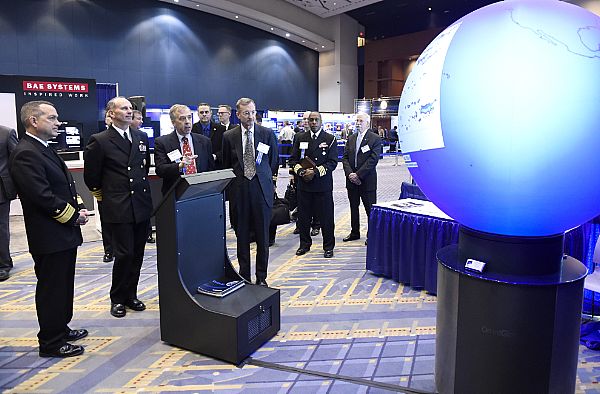 WASHINGTON, D.C. (Feb. 4, 2015) Dr. Reginald Beach, Office of Naval Research (ONR) program officer for littoral geosciences and optics, discusses ONR-sponsored research on the changing sea ice, ocean and atmosphere, with Chief of Naval Operations (CNO) Adm. Jonathan Greenert, during a tour of the exhibit hall at the Naval Future Force Science and Technology (S&T) EXPO. Joining the CNO are Rear Adm. Mat Winter, chief of naval research, left and Dr. Frank Herr, right, head, ONR Ocean Battlespace Sensing Department. U.S. Navy photo by John F. Williams.