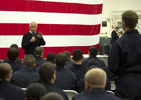 PACIFIC OCEAN (Jan. 14, 2015) Secretary of Defense (SECDEF) Chuck Hagel answers a question from Tucson, Ariz. native Electrician's Mate 2nd Class Jacob Smith during an all-hands call on board the amphibious assault ship USS America (LHA 6). America is the first ship of its class and is optimized for Marine Corps aviation. U.S. Navy photo by Mass Communication Specialist 2nd Class Jonathan A. Colon.