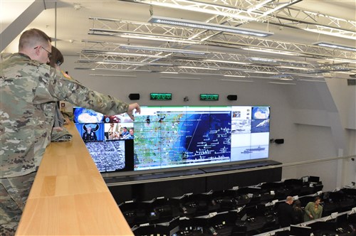 From the catwalk – AFRICOM staff get a bird’s eye view inside AFRICOM’s new joint operations center during open house event, Feb. 5, 2016, U.S. Army Garrison Stuttgart, Germany. (U.S. Africa Command photo by Brenda Law/RELEASED)