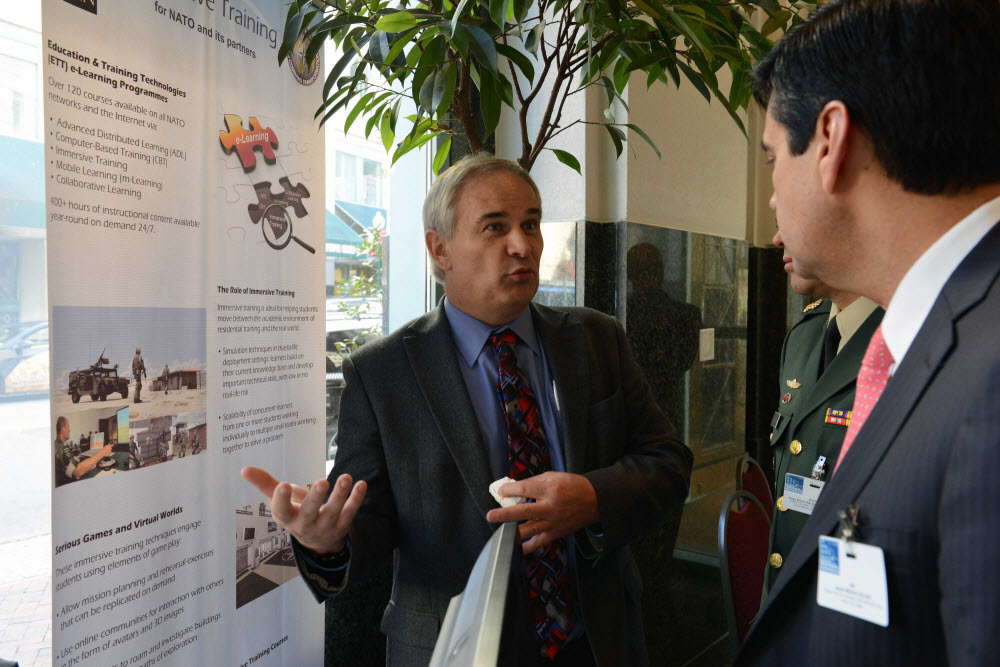 Paul Thurkettle discusses NATO’s Electronic Individual Training and Education Program  during the 2014 COTC. Photo by ACT PAO.