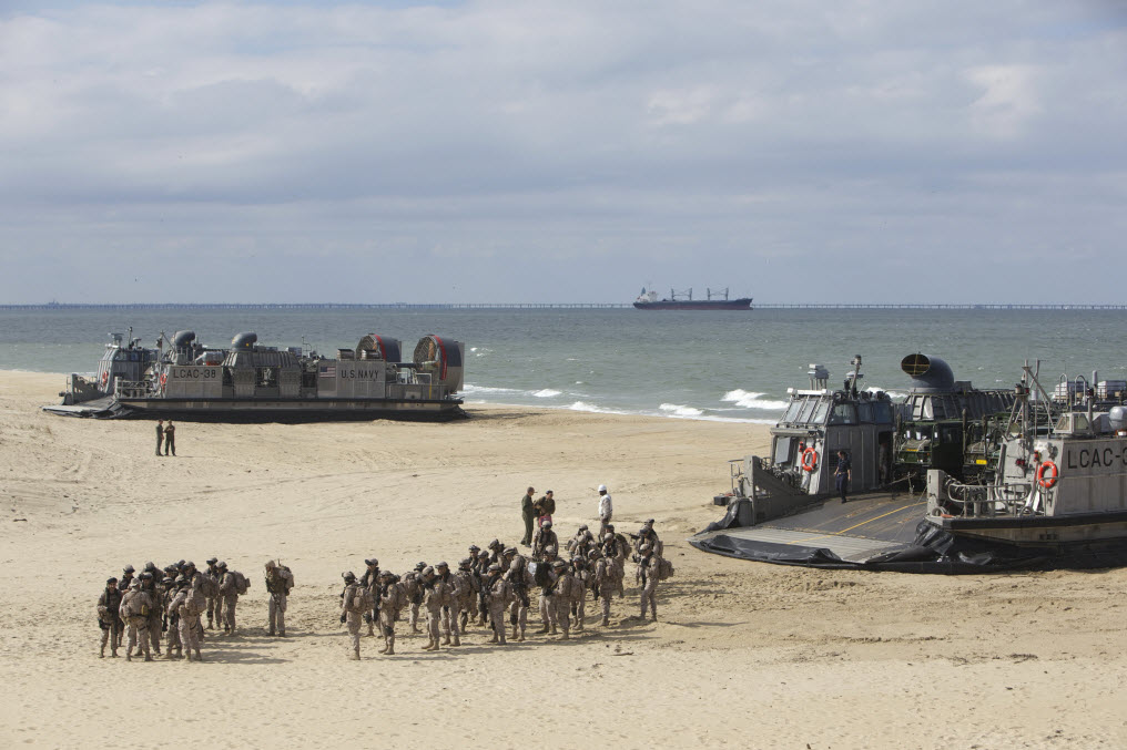 CAMP LEJEUNE, N.C. (Nov. 1, 2014) Spanish marines disembark landing craft air cushions (LCAC) during Bold Alligator 14. The exercise is intended to improve Navy and Marine Corps amphibious core competencies. Working with coalition, NATO, allied and partner nations is a necessary investment in the current and future readiness of our forces. The exercise takes place Oct. 29 - Nov. 10, 2014, afloat and ashore along the Eastern seaboard. #BoldAlligator14 U.S. Navy photo courtesy of the Royal Netherlands Air Force by Sgt. Major Gerben van Es.