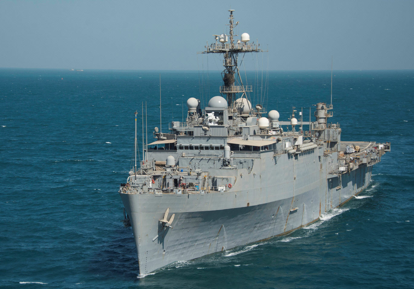 ARABIAN GULF (Sept. 25, 2014) - The afloat forward staging base (interim) USS Ponce (AFSB(I) 15) transits the Arabian Gulf. Ponce is equipped with the Laser Weapon System (LaWS), a technology demonstrator built by Naval Surface Warfare Center Dahlgren Division (NSWCDD). LaWS can be directed onto targets from the radar track obtained from an MK 15 Phalanx Close-In Weapon System or other targeting sources. NSWCDD engineer Alan Tolley - chief engineer for all surface Navy radars, including radars used by LaWS aboard the Ponce - was selected as a National Society of Professional Engineers' (NSPE) 2015 Federal Engineer of the Year Award (FEYA) Agency winner, NSWCDD announced Dec. 10. Tolley was commended for his key role in delivering vital warfare capabilities to the Fleet. U.S. Navy photo by Mass Communication Specialist 2nd Class Daniel M. Young.