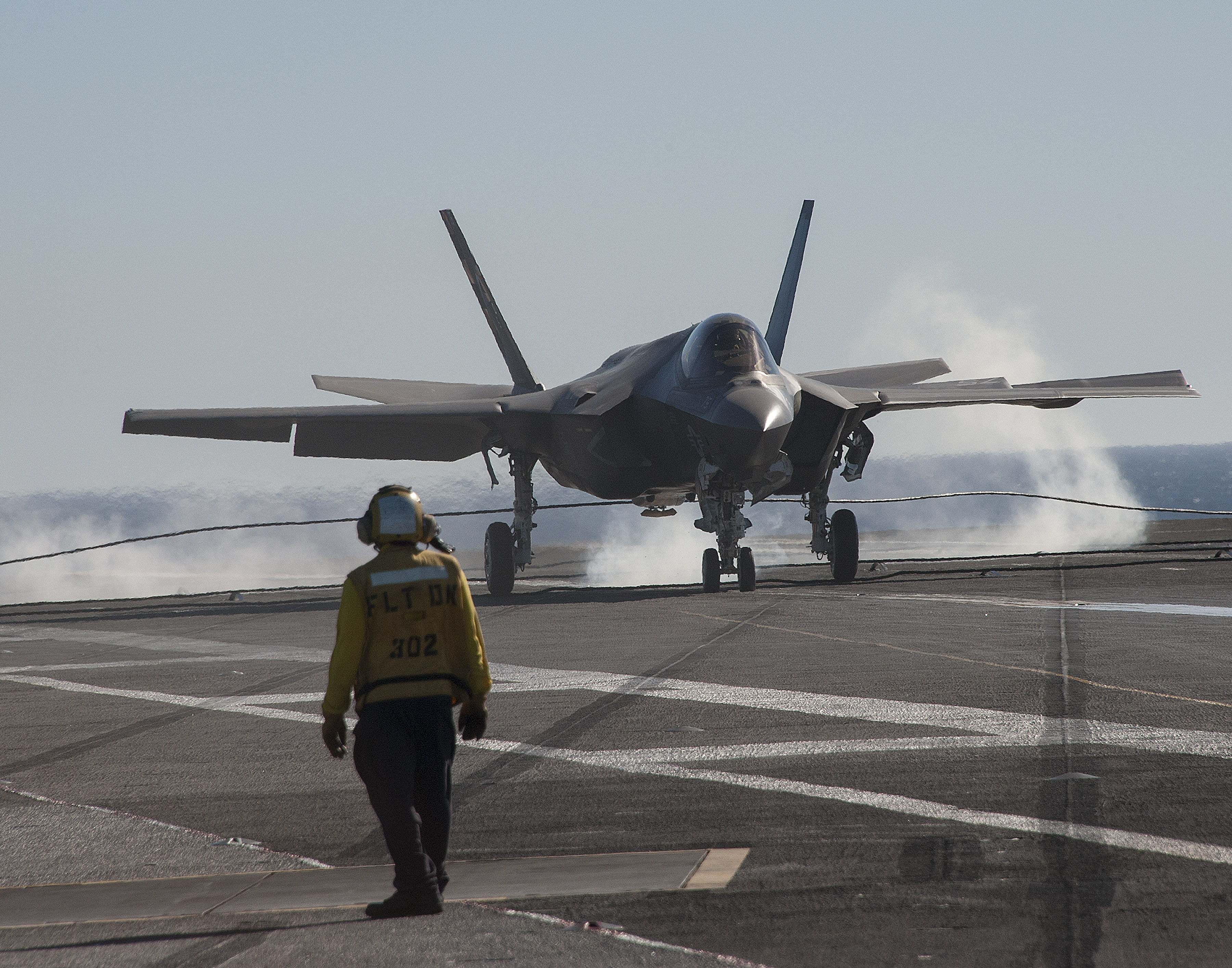 PACIFIC OCEAN (Nov. 6, 2014) An F-35C Lightning II carrier variant joint strike fighter makes an arrested landing aboard the aircraft carrier USS Nimitz (CVN 68). The F-35 Lightning II Pax River Integrated Test Force from Air Test and Evaluation Squadron (VX) 23 is currently conducting initial at-sea trials aboard Nimitz. U.S. Navy photo courtesy of Lockheed Martin by Alexander H Groves.