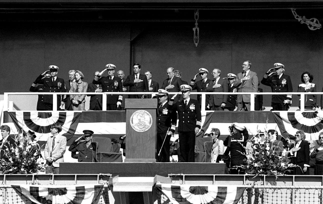 Platform guests render honors at the commissioning of the nuclear-powered aircraft carrier USS Abraham Lincoln (CVN 72).