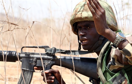 A Senegalese soldier with 1st Paratrooper Battalion gives movement orders to his team during a squad-level exercise July 14, 2016 in Thies, Senegal as part of Africa Readiness Training 16. ART16 is a U.S. Army Africa exercise designed to increase U.S. and Senegalese readiness and partnership through combined infantry training and live-fire events. (U.S. Army photo by Staff Sgt. Candace Mundt/Released)