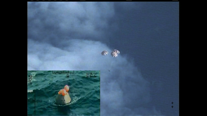 Following a perfect launch and more than four hours in Earth's orbit, NASA's Orion spacecraft is seen from an unpiloted aircraft descending under three massive red and white main parachutes and then shortly after its bullseye splashdown in the Pacific Ocean, 600 miles southwest of San Diego. During the uncrewed test, Orion traveled twice through the Van Allen belt, where it experienced periods of intense radiation, and reached an altitude of 3,600 miles above Earth. The spacecraft hit speeds of 20,000 mph and weathered temperatures approaching 4,000 degrees Fahrenheit as it entered Earth’s atmosphere. Photo courtesy of NASA.