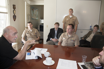 Assistant Secretary of the Navy – Energy, Installations & Environment retired Vice Adm. Dennis McGinn, left, meets with NPS students during a campus visit, Oct. 29. McGinn traveled to NPS to see first hand the work that students and faculty are doing to meet Secretary of the Navy Adm. Ray Mabus’ call to seek “game-changing approaches to energy that will transform how we use it and help us to create sustainable national security for the future.” Photo courtesy of NPS.