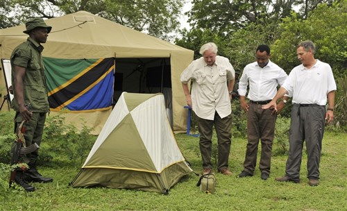 Ambassador Egon Kochanke, German Ambassador to Tanzania, Lazaru Nyalandu, Tanzania Minister of Natural Resources and Tourism, and Ambassador Mark Childress, U.S. Ambassador to Tanzania, look over new ranger field equipment at Selous Game Reserve, Tanzania on Jan. 21, 2015. In a broader effort to combat poaching and illegal trafficking, the U.S. and German governments donated new field equipment for use by the rangers patrolling the reserve. (U.S. Air Force photo by Tech. Sgt. Ian Dean)