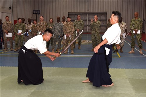 Participants from the Joint Forces Senior Enlisted Professional Development Course view a traditional swordsmanship demonstration at the Japanese base in Djibouti, Nov. 24, 2015. The Japan Self-Defense Forces hosted the second gathering of senior enlisted members to share their culture and mission. (U.S. Air Force photo by Staff Sgt. Victoria Sneed)