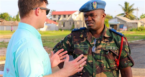 Capt. Bryan Neal, operations planner for 1st Battalion, 9th Field Artillery Regiment, 2nd Brigade Combat Team, 3rd Infantry Division, discusses training priorities for exercise Eastern Accord 2016 with Lt. Col. Hozza, a Tanzanian People’s Defense Force officer, during the final planning event site visit to the Tanzanian Peacekeeping Training Center in Dar es Salaam, Tanzania, May 3. Soldiers of 1-9 FA are supporting EA 2016 this summer as part of the regionally allocated force for U.S. Army Africa and U.S. Africa Command. (U.S. Army Africa photo by Capt. Jarrod Morris)