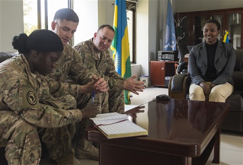 Representatives from the Combined Joint Task Force-Horn of Africa Army civil affairs battalion and information operations office sign a guest book at the Rwanda Peace Academy Feb. 4, 2016, in Musanze, Rwanda. Rwanda is one of the largest contributors of forces to peacekeeping operations in East Africa. The Ministry of Defence's impact continues to expand as the Rwanda Peace Academy takes on a larger role as an international training, research and education center. (U.S. Air Force photo by Senior Airman Peter Thompson)