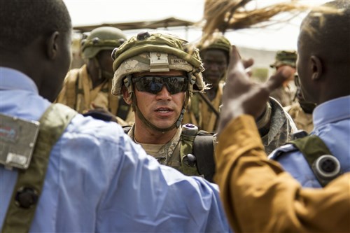 Soldiers from 1st Bn., 28th Inf. Regt., 4th IBCT, 1st Inf. Div. interact with role players during a situational training exercise in Exercise Western Accord 14, June 24. Exercise Western Accord 14 is a U.S. Army Africa-hosted annual joint training and partnership exercise between the United States and Economic Community of West Africa States, which is designed to increase interoperability between military forces and ensure the common ability to conduct peace operations throughout Western Africa.