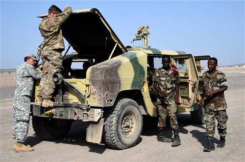 CAMP CHEIK OSMAN, Djibouti – Djiboutian Armed Forces (FAD) Soldiers prepare their Humvee for the final test after completing a five-month training course instructed by the U.S. Army Regionally Aligned Forces Soldiers, May 16, 2016, at Camp Cheik Osman, Djibouti. The FAD soldiers tested the skills they learned by demonstrating their reactions to various mock situations from convoying through a road block, identifying mock roadside bombs, medical care, and vehicle recovery. (U.S. Air Force photo by Staff Sgt. Tiffany DeNault/Released)