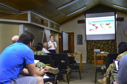 French Army Capt. Emilie Javelle, Internal medicine clinician, teaches medical professionals about the Chikungunya virus during the Military Tropical Medicine seminar May 11, 2016 at Camp Lemonnier, Djibouti. Javelle talked about the symptoms and treatments of Chikungunya as there is currently no vaccine for the disease. (U.S. Air Force photo by Senior Airman Benjamin Raughton/Released)