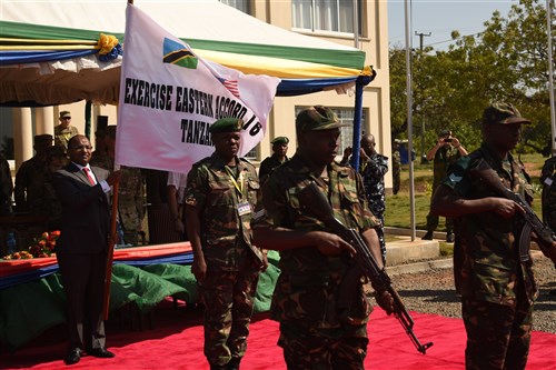 DAR ES SALAAM, Tanzania – Hussein Ali Mwyini, Minister of Defense and National Service, presents the Eastern Accord 2016 flag representing the commencement of the command post exercise the Tanzanian Peacekeeping Training Centre on July 11, 2016, in Dar es Salaam, Tanzania. EA16 is an annual, combined, joint military exercise that brings together partner nations to practice and demonstrate proficiency in conducting peacekeeping operations. (U.S. Air Force photo by Staff Sgt. Tiffany DeNault/Released)