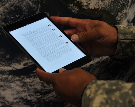 A soldier reads a new Army doctrine supplement e2Book on a computer tablet. Making training, educational and doctrinal material available on mobile devices is part of the Army’s e-publishing effort. U.S. Army photo.