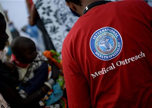 U.S. Air Force Airmen assist patients during a medical outreach event June 22, 2016 at Lokusero, Kenya. The medical outreach was part of the first African Partnership Flight in Kenya. Over the course of three days, medical assistance was provided for more than 1,250 patients. The APF is designed for U.S. and African partner nations to work together in a learning environment to help build expertise and professional knowledge and skills. (U.S. Air Force photo by Tech. Sgt. Evelyn Chavez/Released)