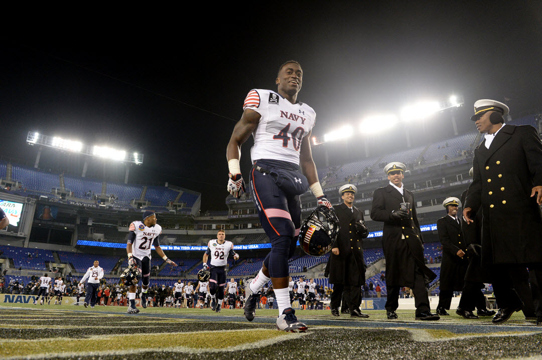 BALTIMORE (Dec. 13, 2014) Navy slot back Kendrick Mouton exits the field with his teammates after Navy won the 115th Army-Navy game in Baltimore. Navy beat Army 17-10. (U.S. Navy photo by EJ Hersom. 