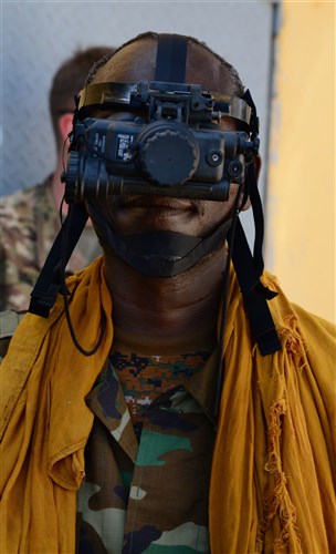 A Djiboutian soldier poses for a photo before taking part in a night vision goggles training exercise in Djibouti City, Oct. 10, 2016. Soldiers learned the components of an NVG kit, accountability, proper wear, usage and tactics such as signaling teammates during the four-day course.  (U.S. Air Force photo by Staff Sgt. Benjamin Raughton)