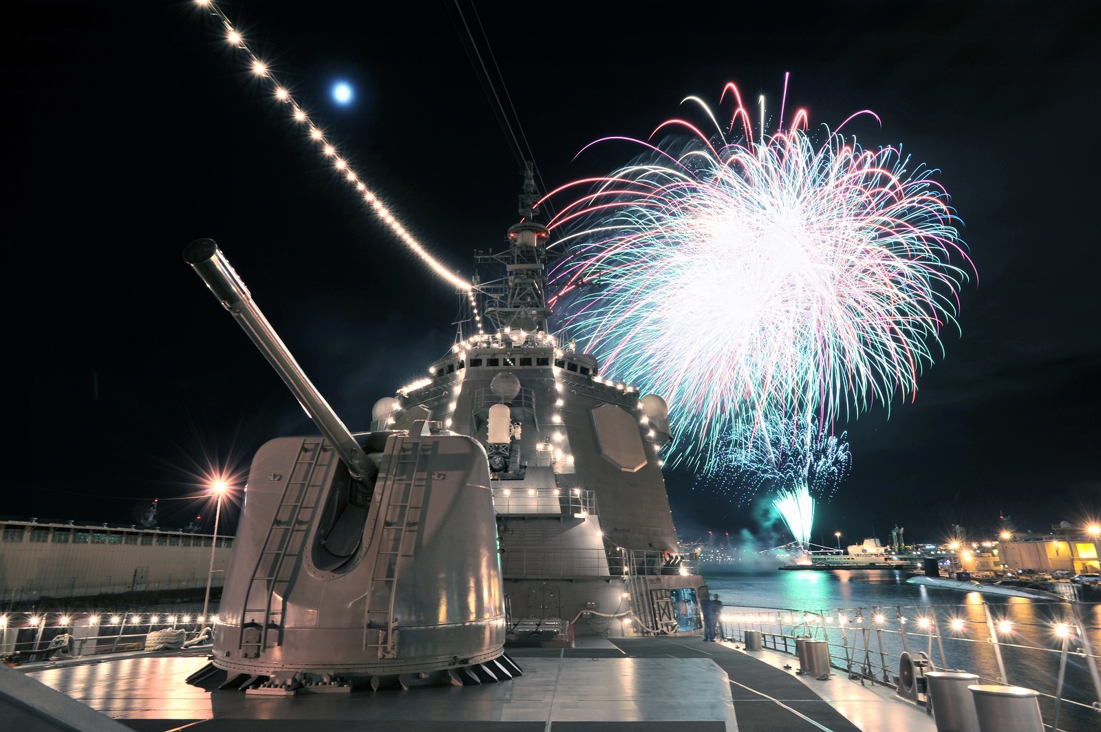 Fireworks light up the sky behind JS Kirishima (DDG-174) as part of Joint Base Pearl Harbor Hickam Fourth of July celebrations. During Rim of the Pacific (RIMPAC) exercise. Japan Maritime Self-Defense Force photo by Photographer PO1 Makoto Maeda.