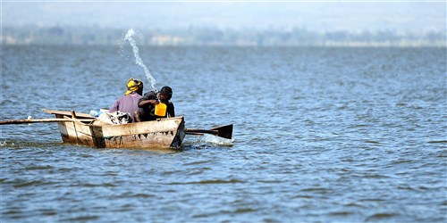 HAWASSA, Ethiopia (Dec. 8, 2011) - A fisherman bails water from a handmade boat while fishing at a lake in Hawassa, Ethiopia, December 8. According to Addisu Wedhao, attachhÃ to the U.S. embassy in Ethiopia, many of the tools and devices used to hunt, fish and grow crops in Ethiopia are made by hand. (U.S. Air Force photo by Senior Airman Jarad A. Denton)