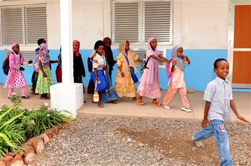 ALI SABIEH, Djibouti - Students walk in front of the newly-renovated Ali Sabieh school, December 19, 2009 in Djibouti. U.S. Seabees deployed to Combined Joint Task Force - Horn of Africa began working on the Ali Sabieh school in April, renovating the school&#39;s roof, sidewalk, fence, bathrooms and installing new doors and windows. (Master Sergeant Carlotta Holley, CJTF-HOA)