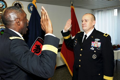 STUTTGART, Germany - General William E. &#34;Kip&#34; Ward (left), commander of U.S. Africa Command (AFRICOM), conducts the Army Oath of Office with Brigadier General Christopher K. Haas, Special Operations Command Africa (SOCAFRICA) commander, during a frocking ceremony, December 18, 2009, at Kelley Barracks in Stuttgart, Germany.  Haas, SOCAFRICA&#39;s commander since August, received his first star and new rank of Brigadier General during a small ceremony in front of family, friends and fellow members of both commands. (Photo by U.S. Army Master Sergeant Donald Sparks)